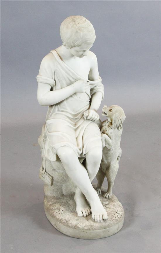 Achille Casoni (Italian, 19th century). A Carrara white marble carving of a seated boy with a begging dog, height 31in.